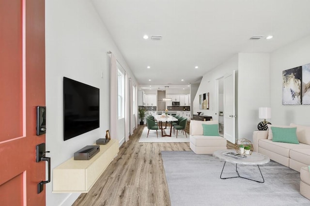 living room with light hardwood / wood-style floors