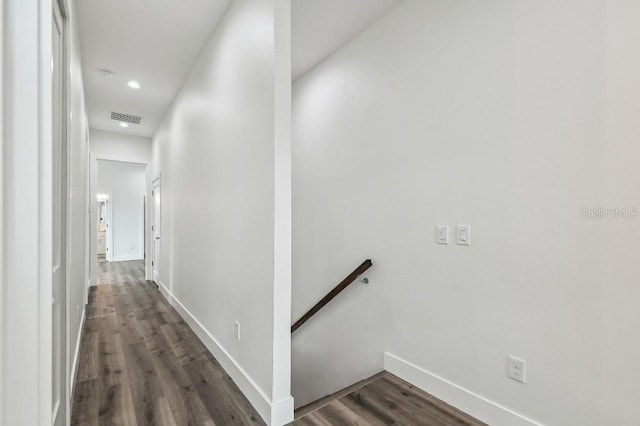 hallway with dark hardwood / wood-style floors