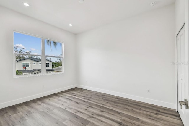 empty room with wood-type flooring