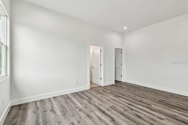 empty room with light hardwood / wood-style floors