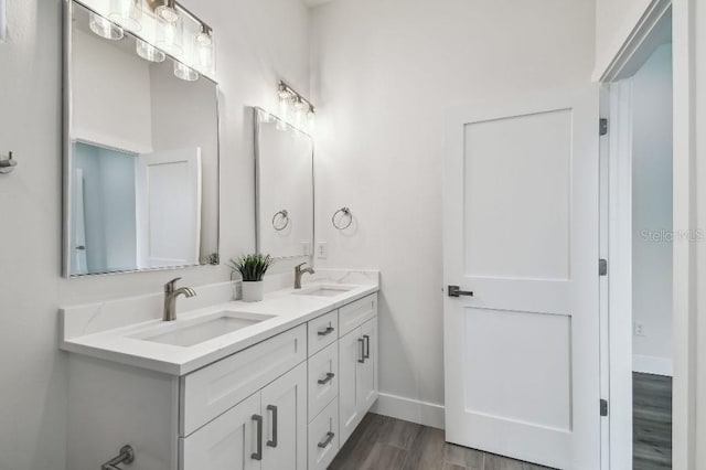 bathroom featuring vanity and hardwood / wood-style floors