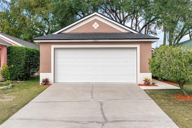 garage with a lawn