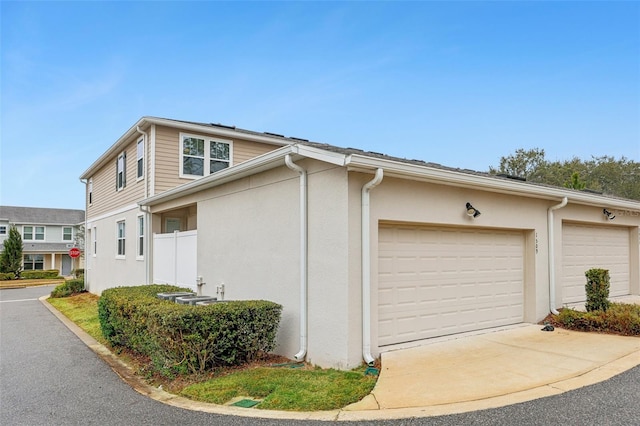 view of side of property with a garage