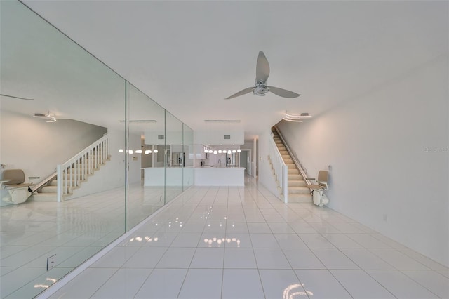 interior space featuring ceiling fan and tile patterned flooring