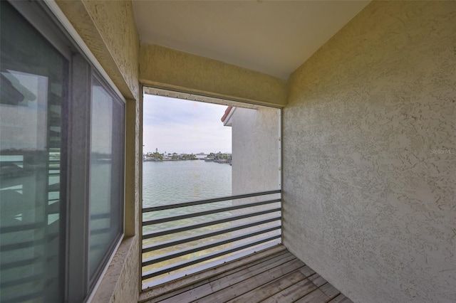 balcony featuring a water view