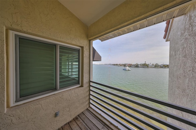 balcony featuring a water view