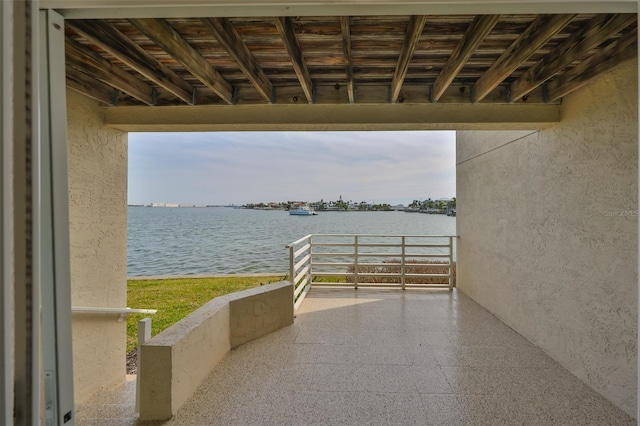 view of patio with a water view