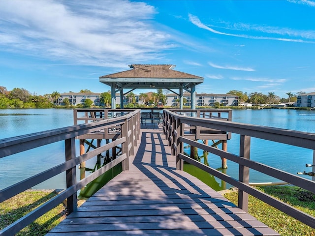 dock area with a gazebo and a water view