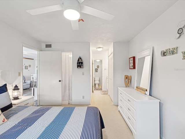 bedroom featuring ceiling fan and connected bathroom