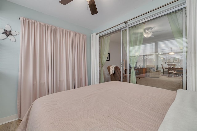 bedroom featuring ceiling fan and hardwood / wood-style floors