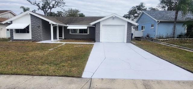 single story home with a garage and a front lawn