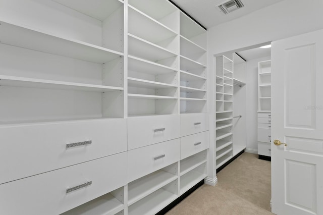 walk in closet with carpet flooring and visible vents