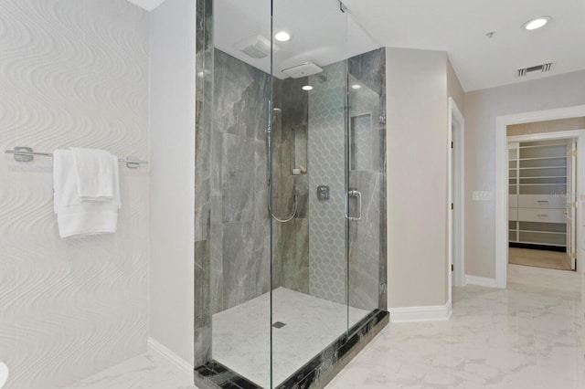 full bathroom featuring visible vents, baseboards, marble finish floor, and a shower stall