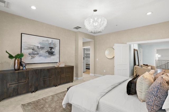 bedroom with recessed lighting, visible vents, light carpet, and an inviting chandelier