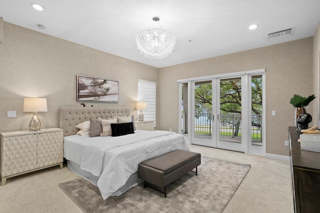 carpeted bedroom featuring visible vents, recessed lighting, access to exterior, french doors, and a chandelier