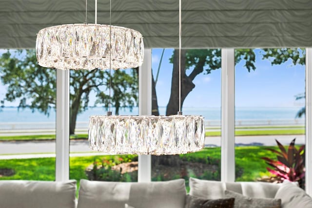 exterior space with a chandelier and a water view