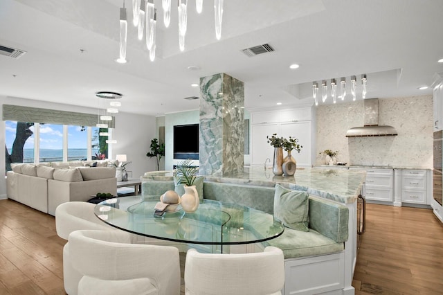 dining space featuring recessed lighting, visible vents, and light wood finished floors