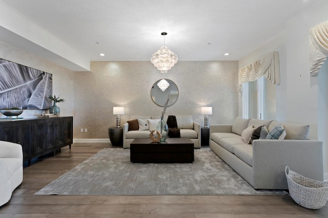 living room with hardwood / wood-style flooring and a chandelier