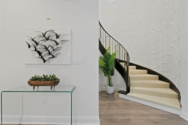 stairway with wood-type flooring