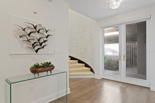 entrance foyer featuring french doors and light wood-type flooring