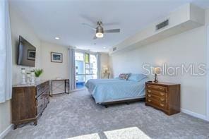 carpeted bedroom featuring ceiling fan