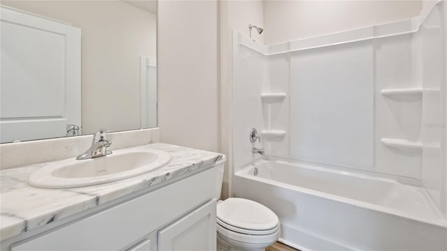 full bathroom with shower / tub combination, vanity, and toilet