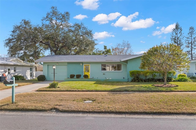 ranch-style home featuring a front yard