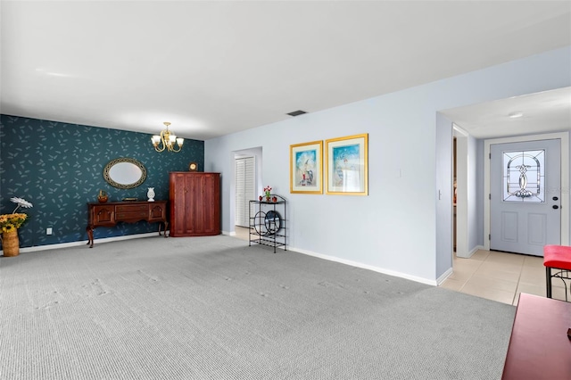 interior space featuring light colored carpet and a notable chandelier