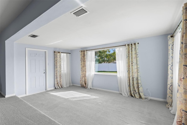 unfurnished bedroom with light colored carpet