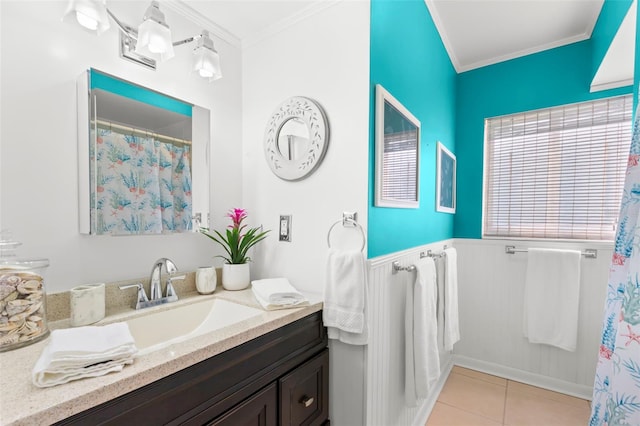 bathroom with ornamental molding, tile patterned flooring, and vanity