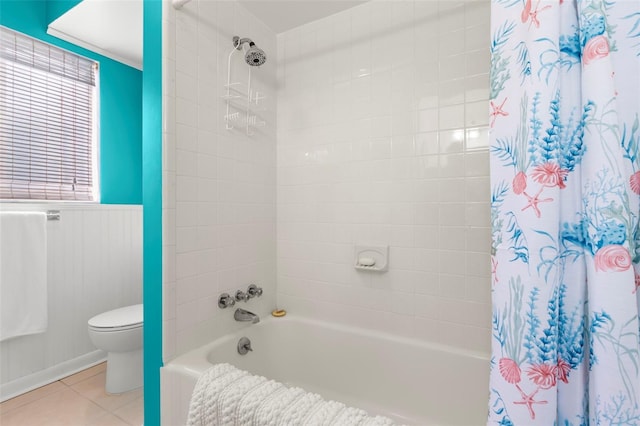 bathroom with shower / tub combo with curtain, toilet, and tile patterned flooring