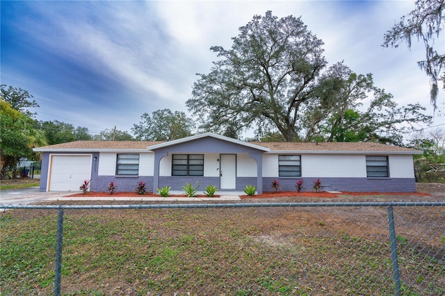 ranch-style home featuring a garage