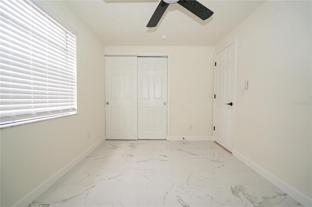 unfurnished bedroom with a closet and ceiling fan