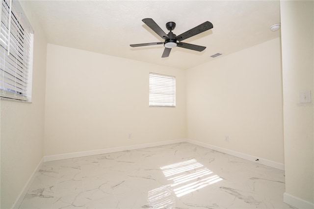 spare room with ceiling fan