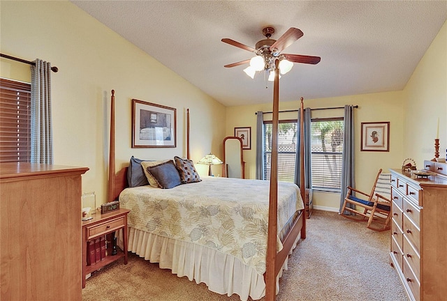 bedroom with lofted ceiling, light colored carpet, and a textured ceiling