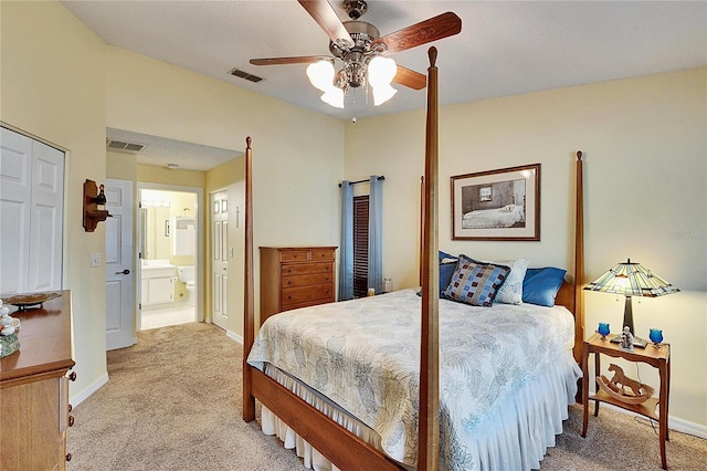 carpeted bedroom featuring connected bathroom and ceiling fan