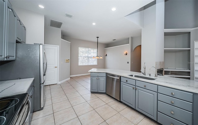 kitchen with sink, gray cabinets, dishwasher, pendant lighting, and light stone countertops