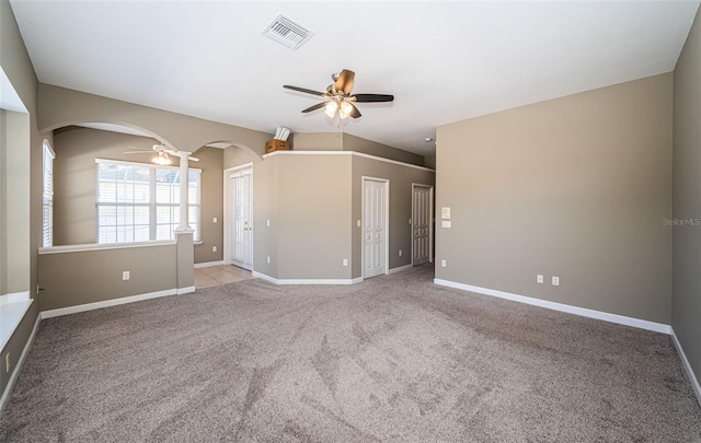 spare room with light colored carpet and ceiling fan