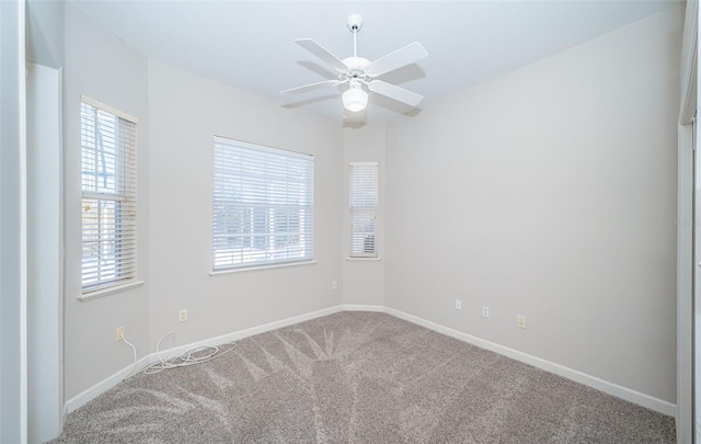 carpeted empty room with ceiling fan