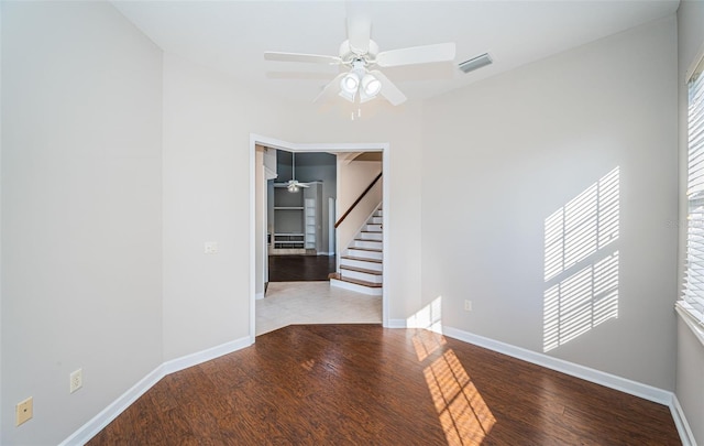 unfurnished room with ceiling fan and wood-type flooring