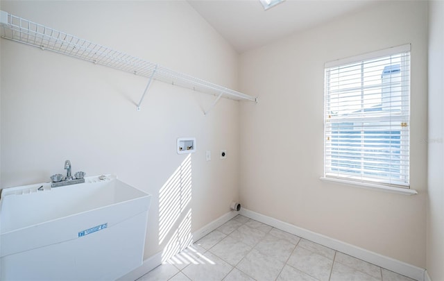 washroom featuring washer hookup, hookup for an electric dryer, and light tile patterned floors