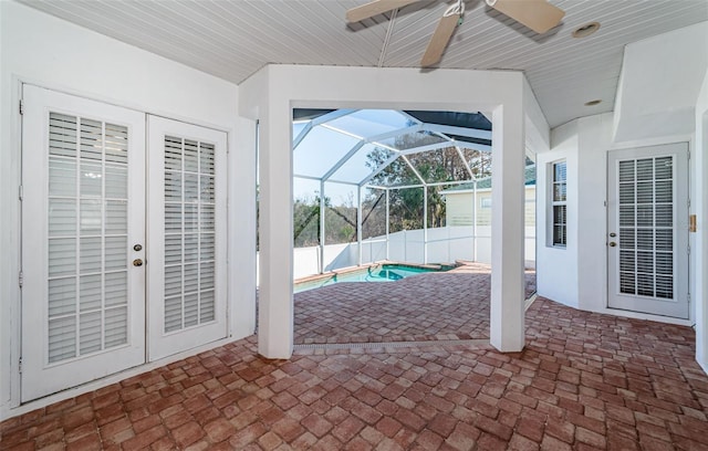 view of patio with a fenced in pool, french doors, ceiling fan, and glass enclosure