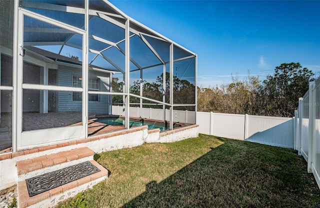 view of yard with a lanai and a fenced in pool