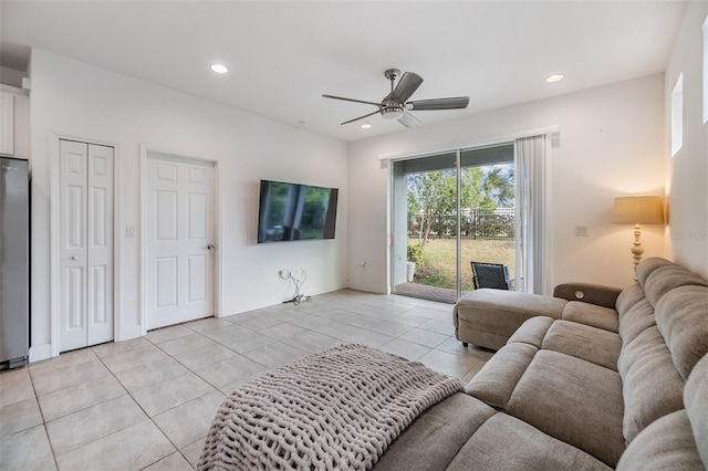 living room with light tile patterned floors and ceiling fan