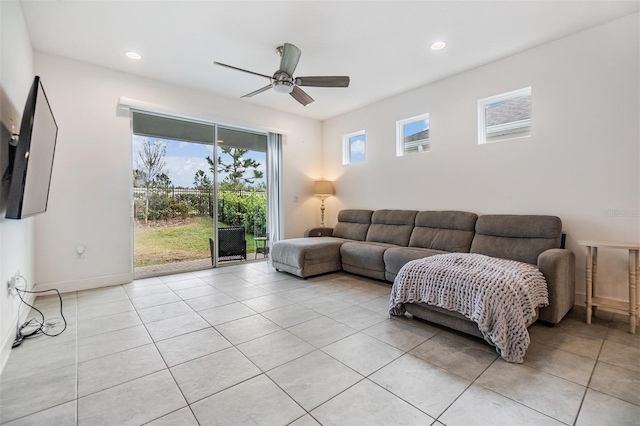 tiled living room with ceiling fan