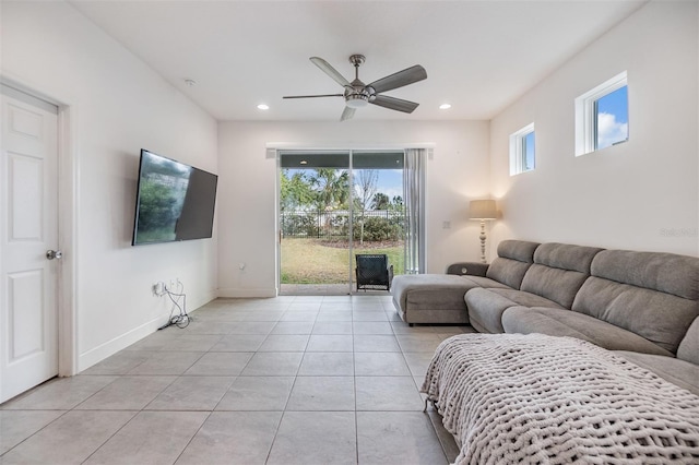 tiled living room with ceiling fan