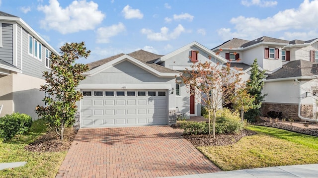 view of front of home with a garage and a front yard