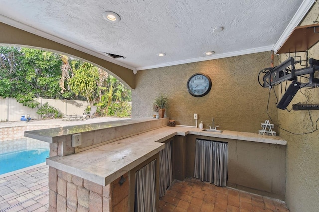 view of patio with sink and area for grilling