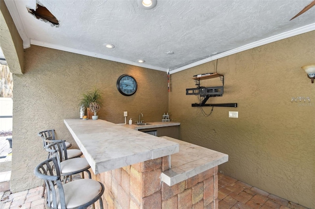 bar with sink and ornamental molding