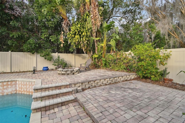 view of patio / terrace featuring a fire pit